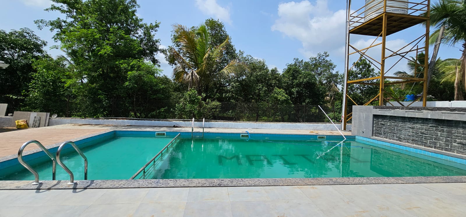 Pool with Maitri lettering in the water